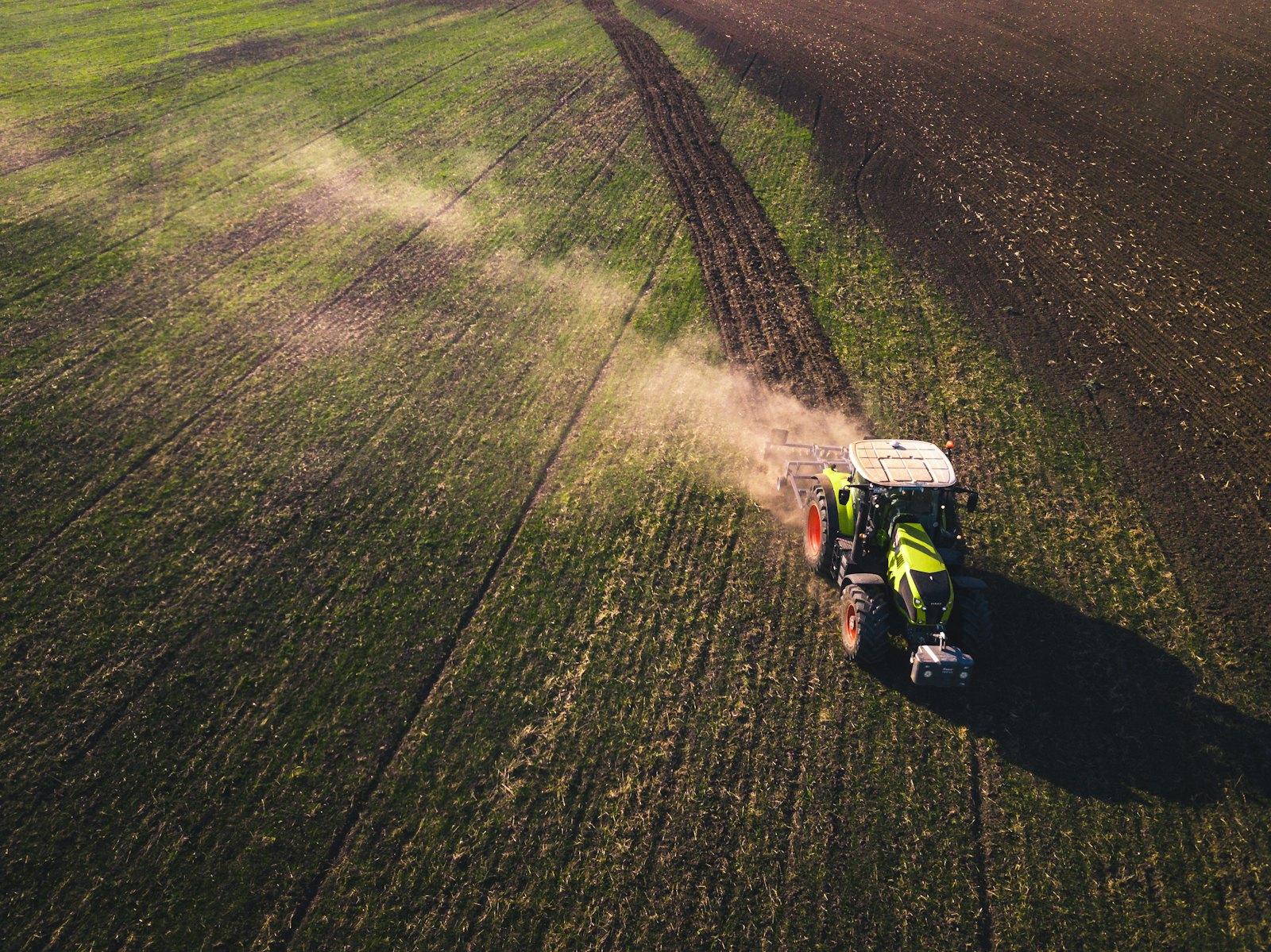 Farm equipment working a field